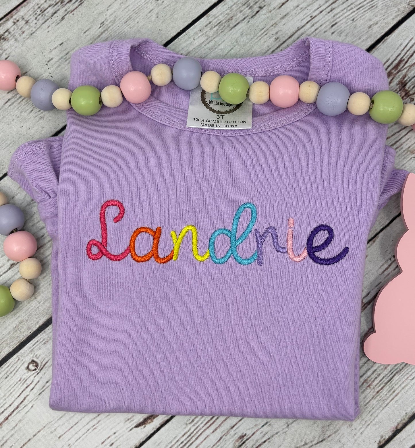 Personalized Rainbow Name Ruffle Shirt for Girls | Bright Script Embroidered Custom Tee